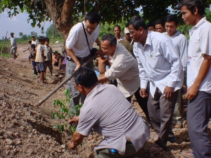 From excavation to tree planting for erosion control: Villagers do it all.